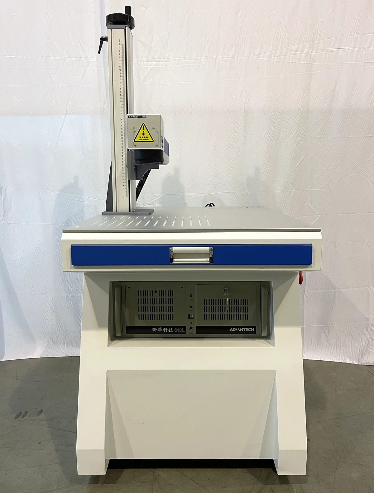 Front view of the Laserhi standard fiber laser marking machine with its work table and control drawer