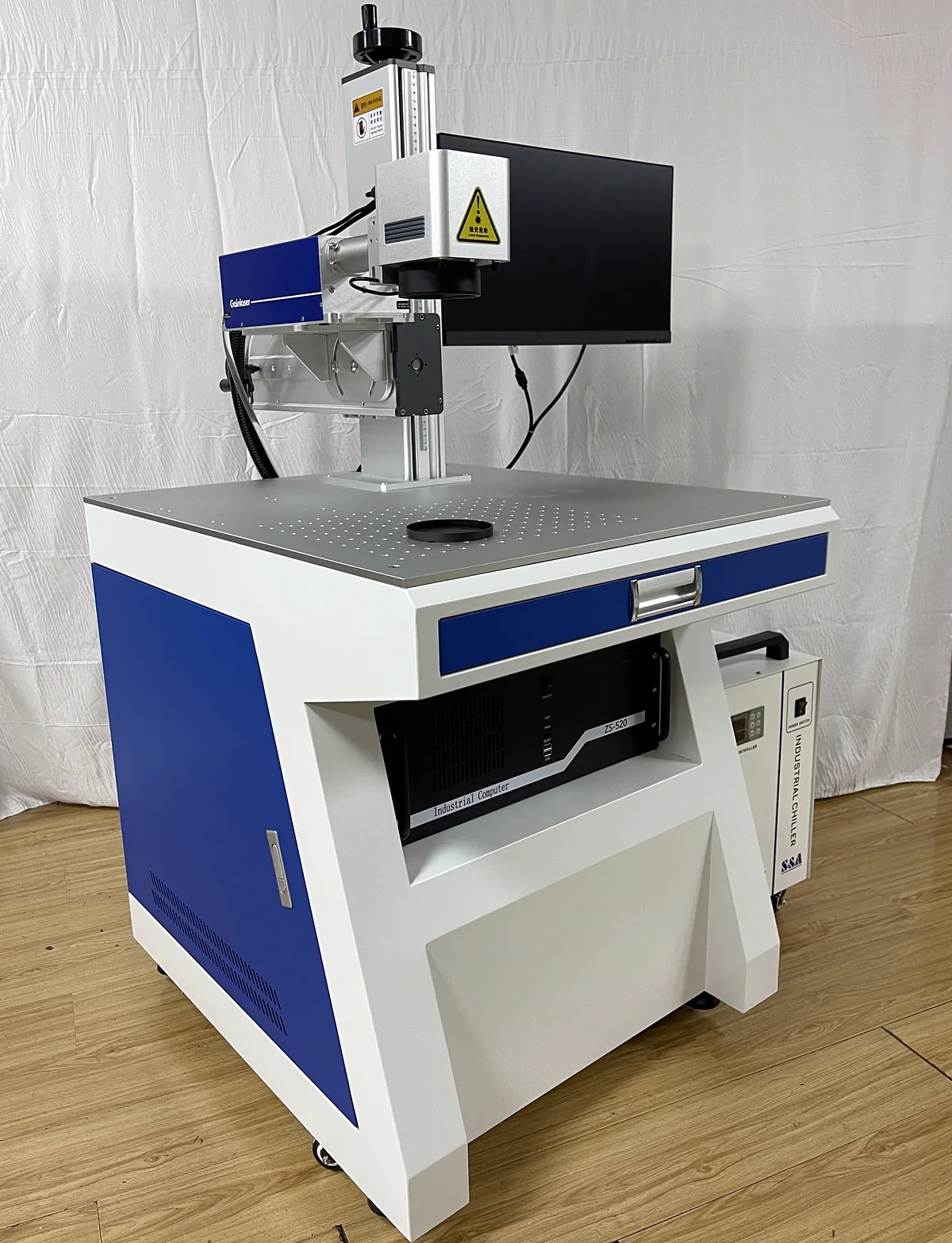 Laserhi 355 nm UV laser marking machine beside its water chiller, three-quarter view
