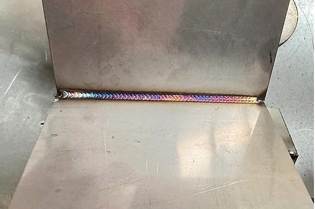 Laser weld seam running along a folded stainless steel part